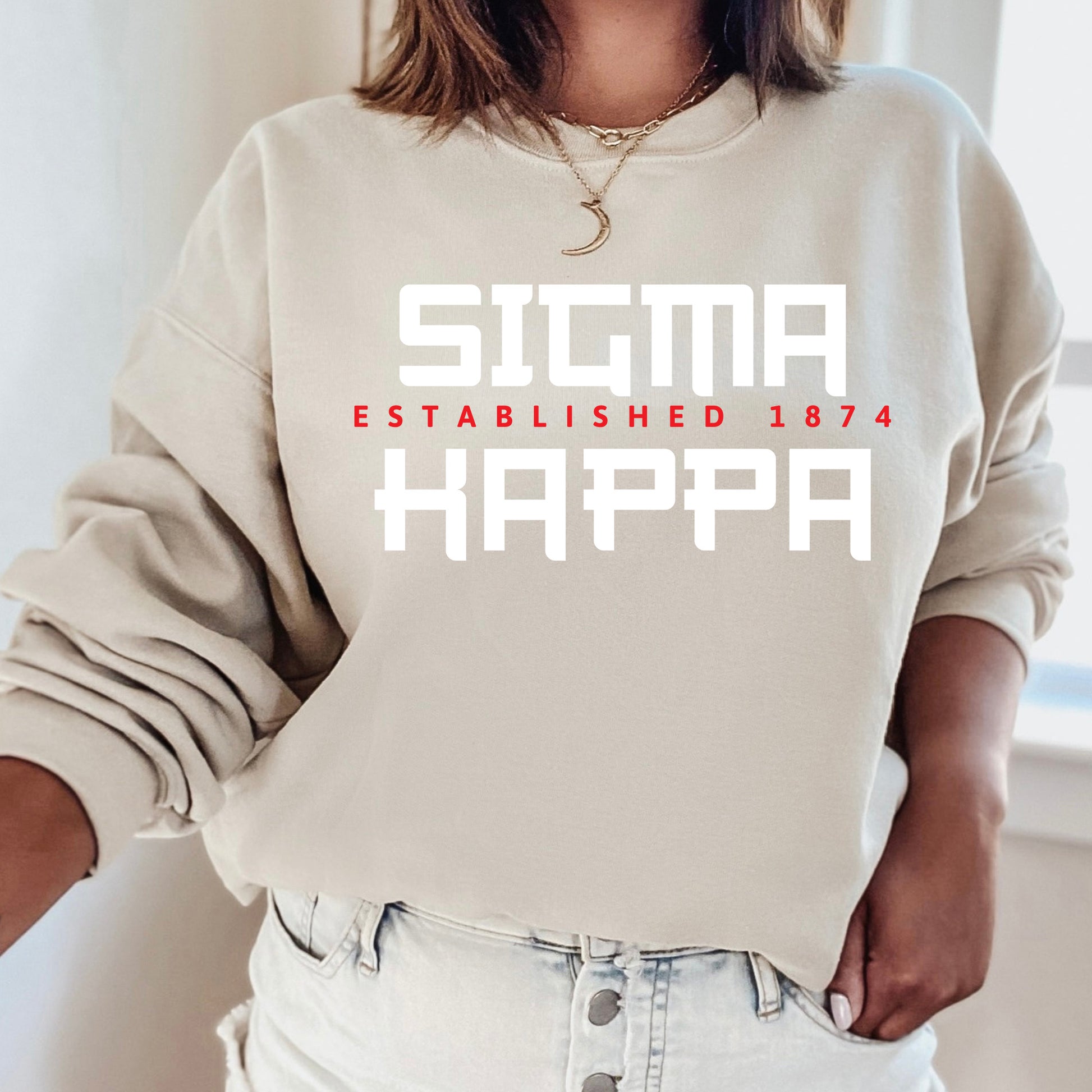 a woman wearing a sweatshirt that says stigma established happy