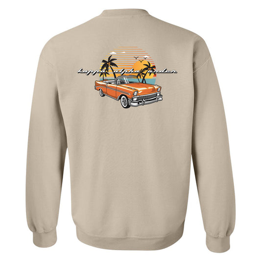 a beige sweatshirt with an orange car and palm trees