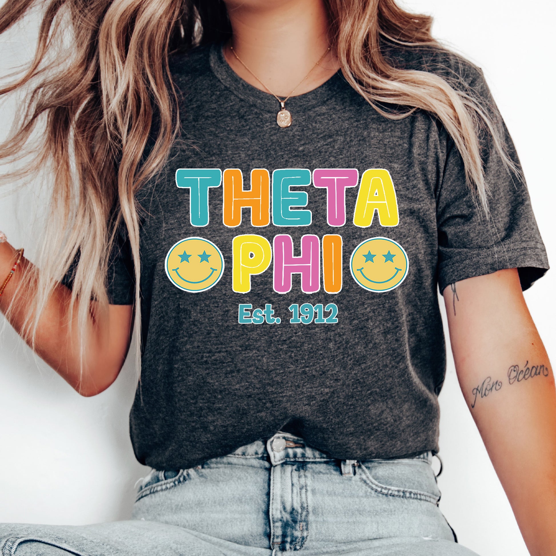 a woman wearing a t - shirt that says thea ophi