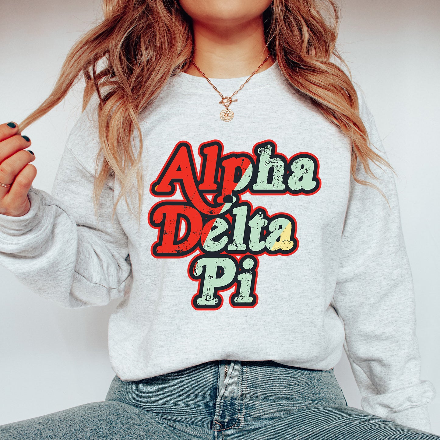 a woman wearing a sweatshirt that says aloha delta pi