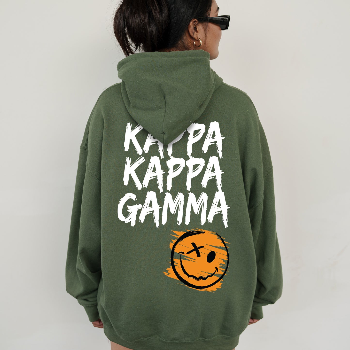 a woman wearing a green hoodie that says kalppa kappa ga