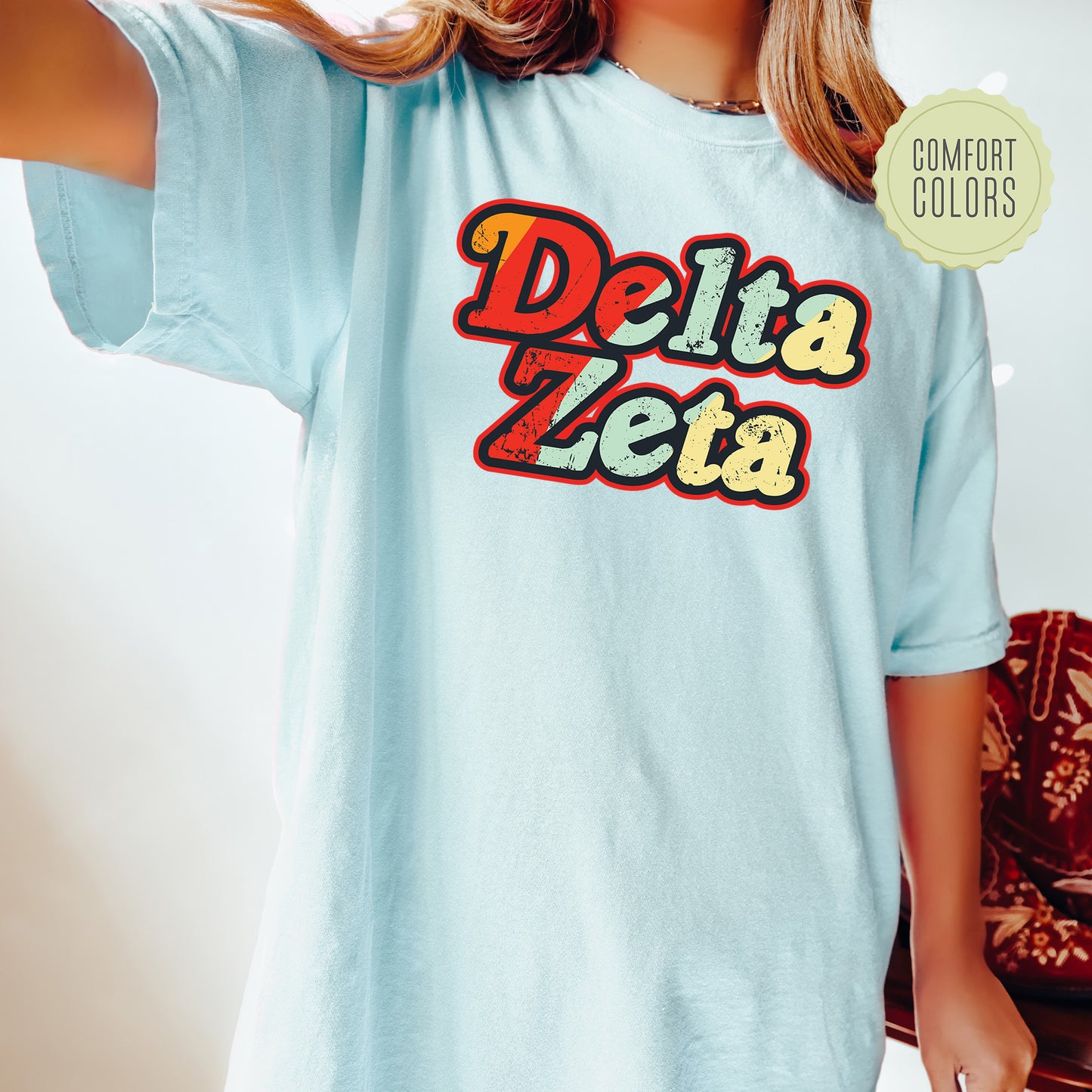 a woman wearing a blue delta delta t - shirt
