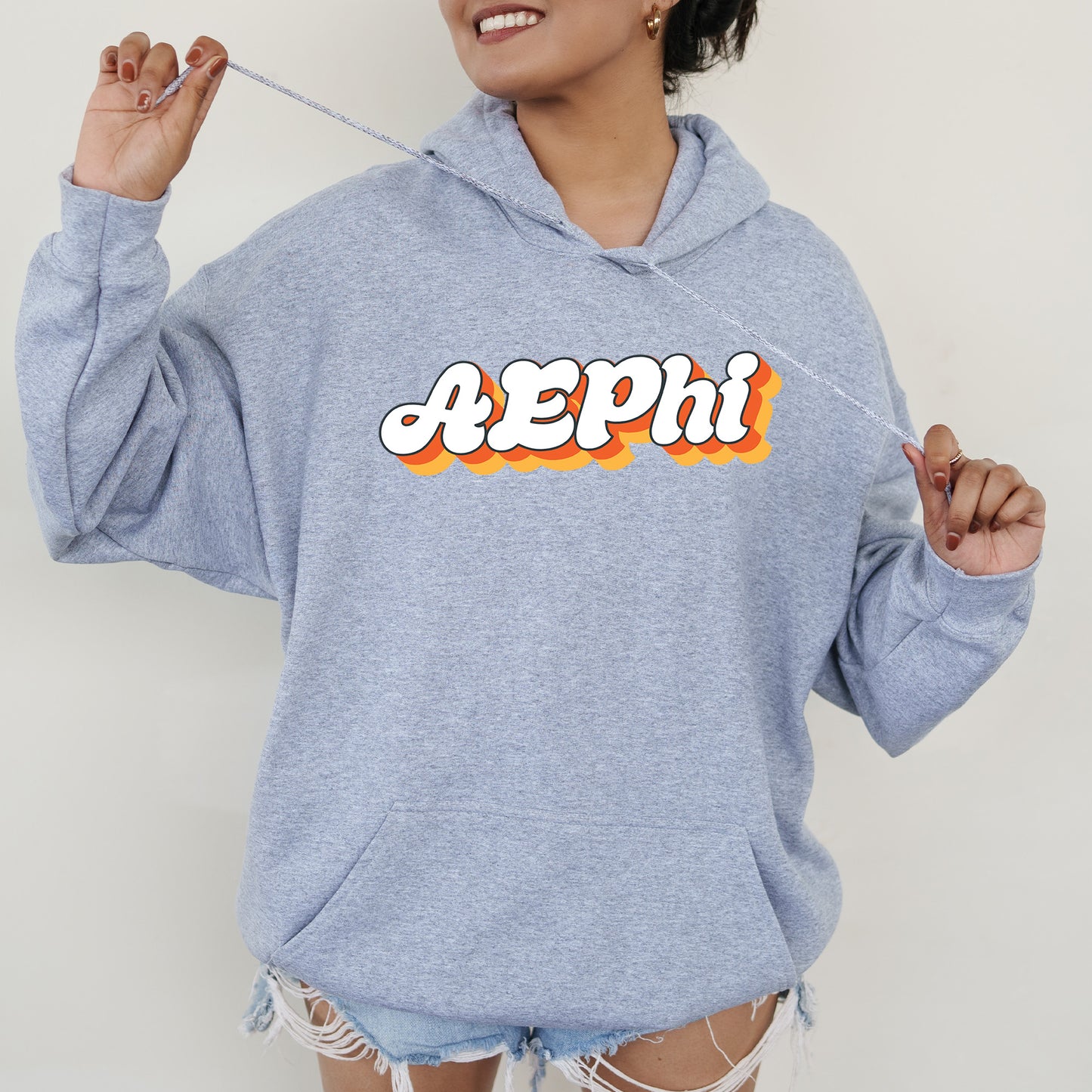 a woman in a blue hoodie with the word peppi on it