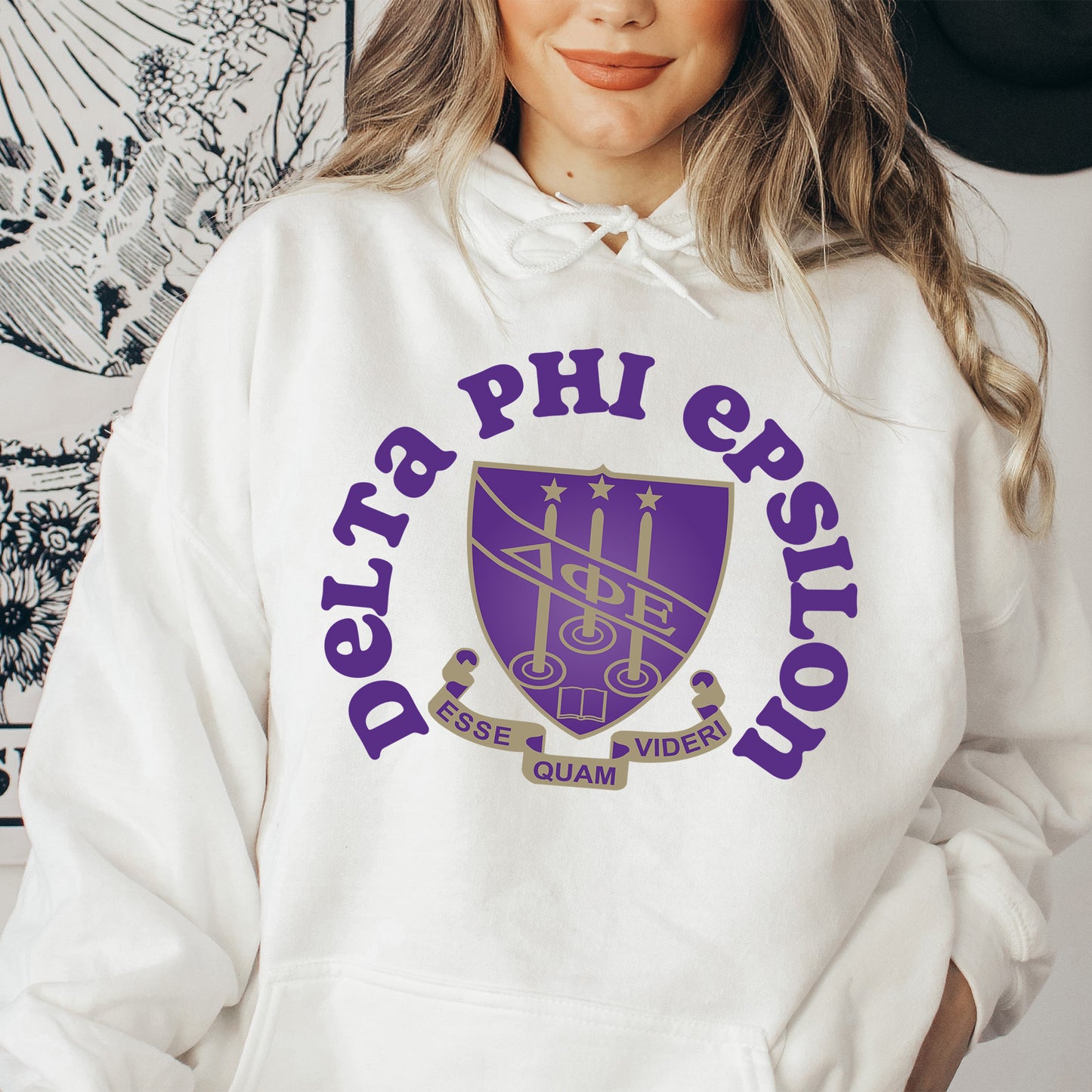 a woman wearing a purple and white hoodie