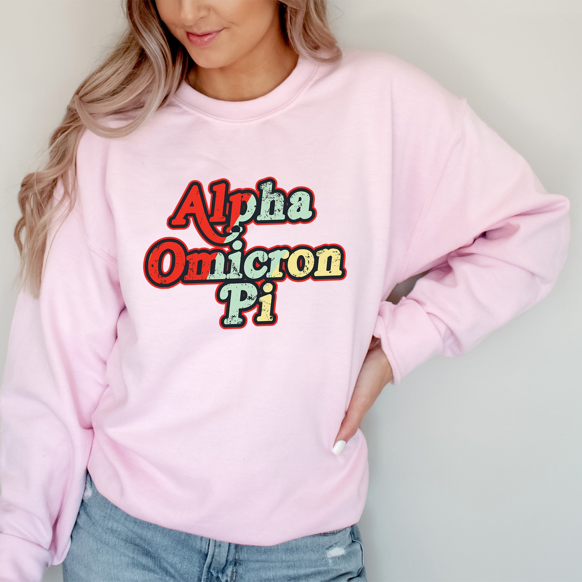 a woman wearing a pink sweatshirt with the words aloha and oregon on it