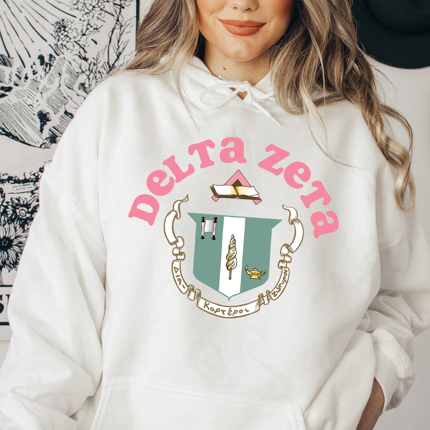 a woman in a white hoodie with a hat on her head