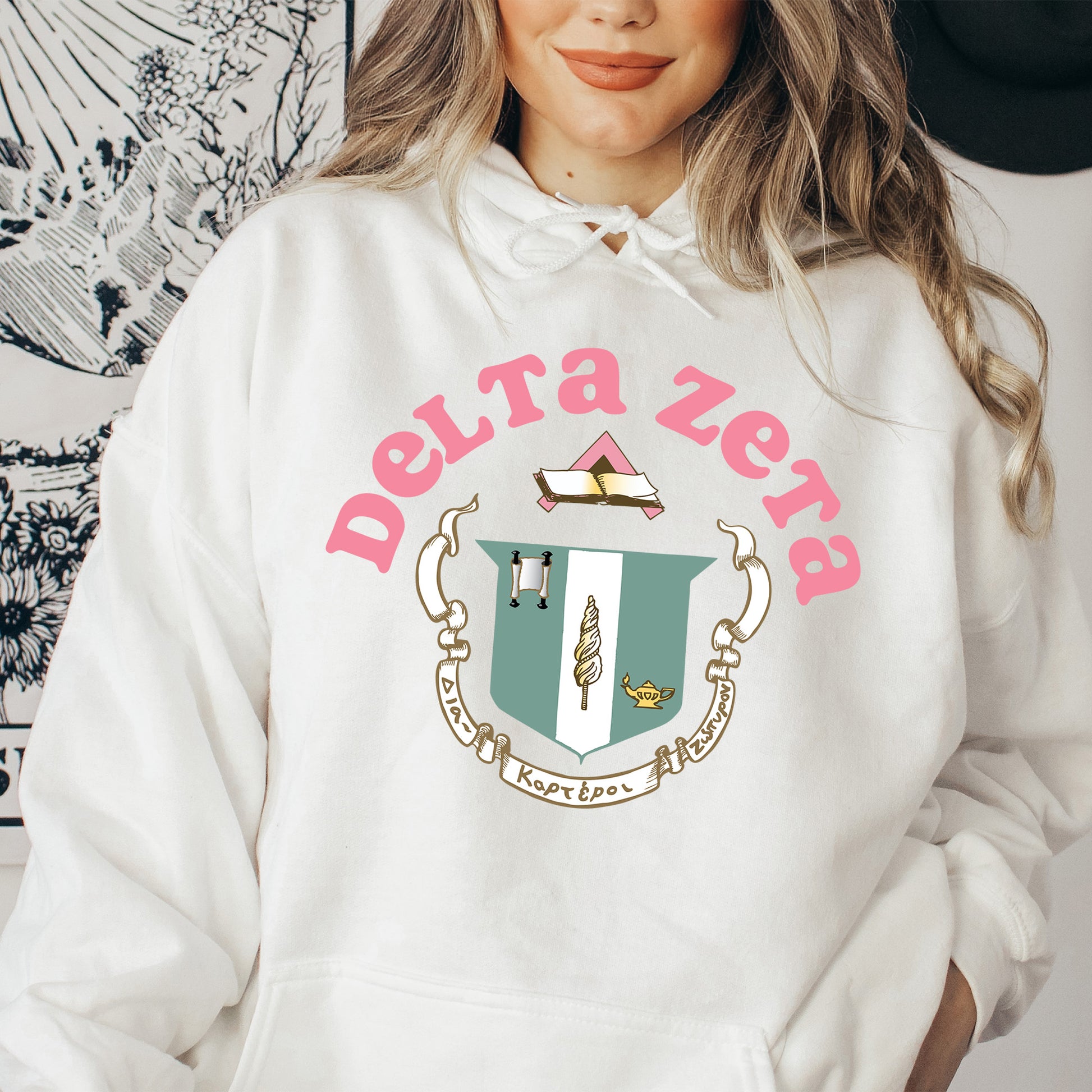 a woman in a white hoodie with a hat on her head