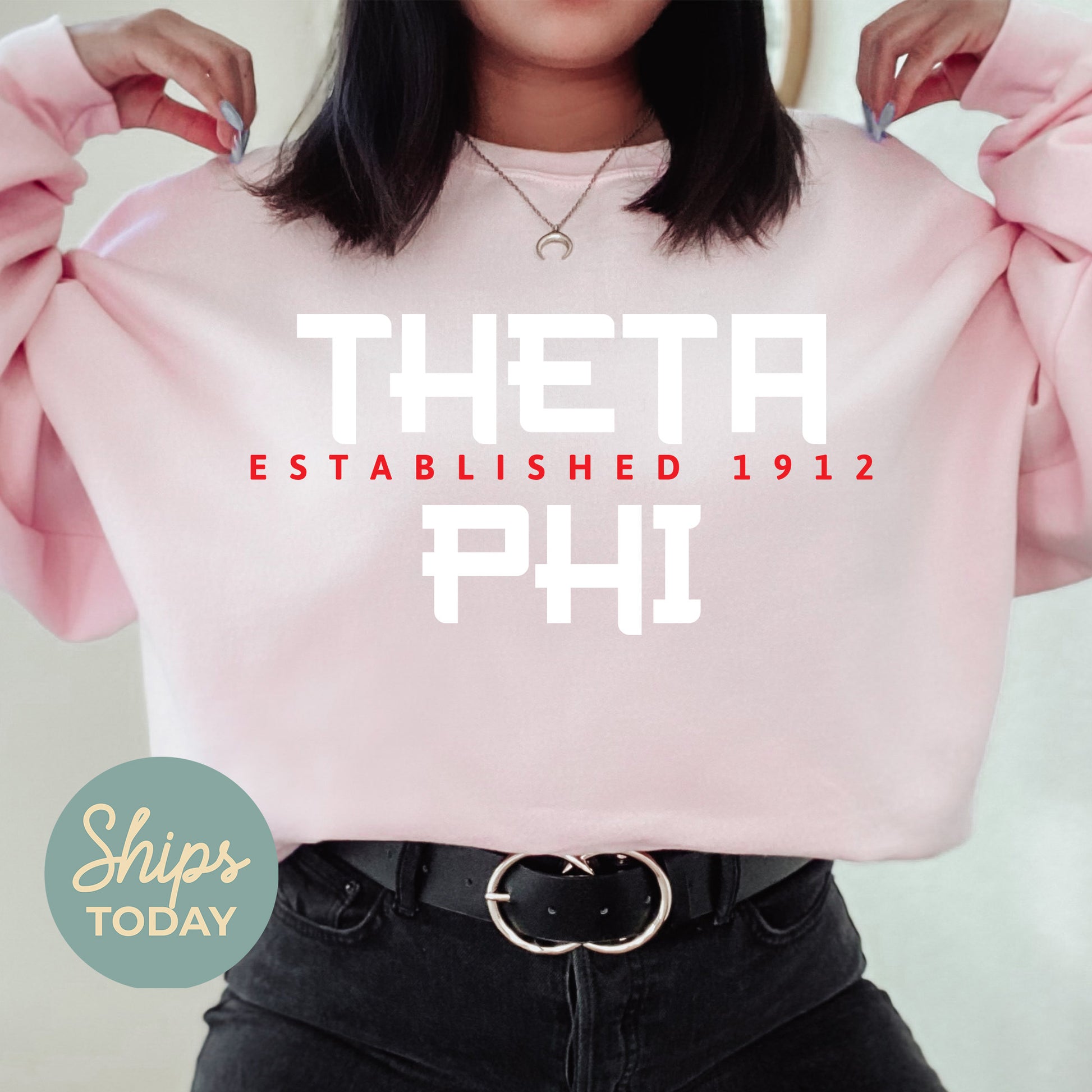 a woman wearing a pink sweatshirt with the words, thera established 1911