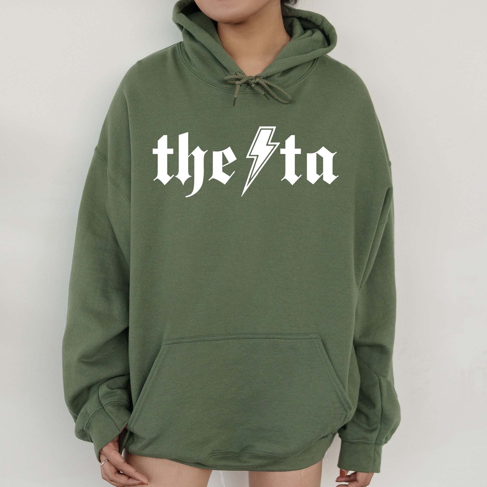 a person wearing a green hoodie with the word the sta printed on it