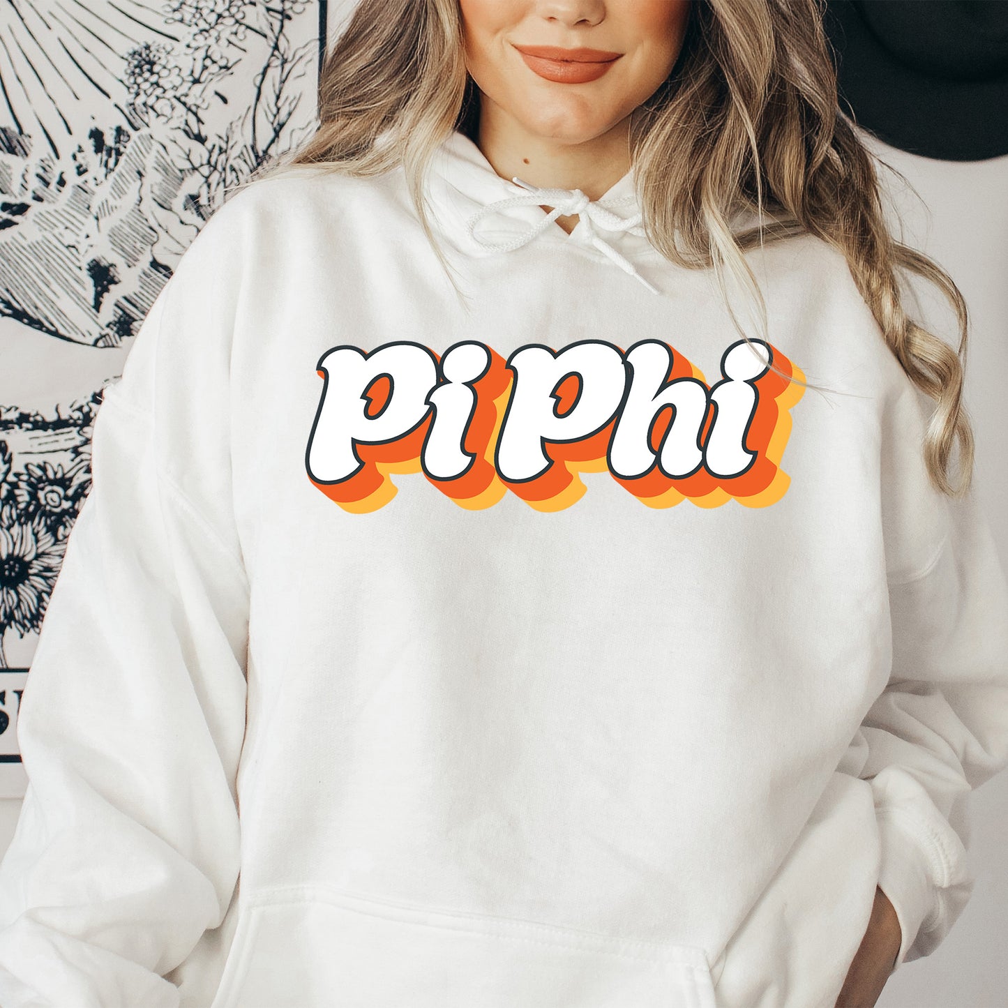 a woman wearing a white hoodie with the word pippi on it