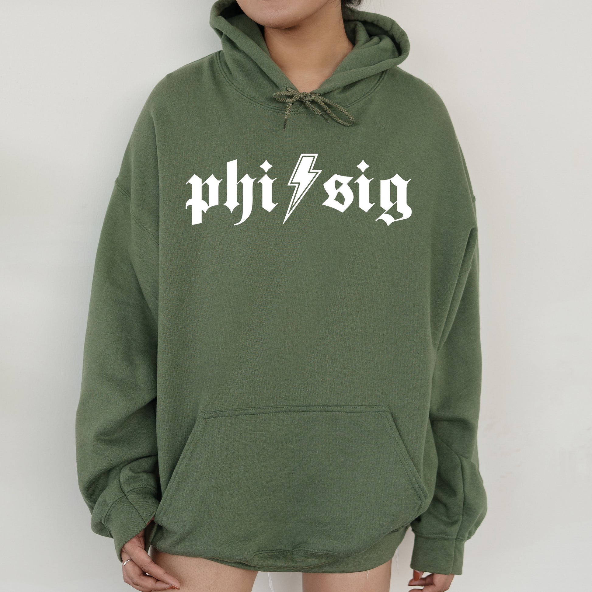 a person wearing a green hoodie with a lightning bolt on it