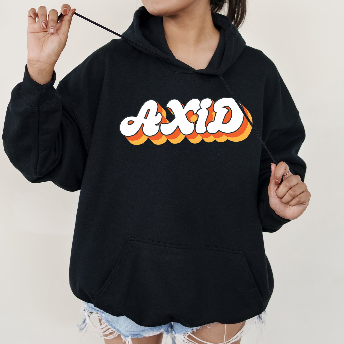 a woman wearing a black hoodie with the word dixie printed on it