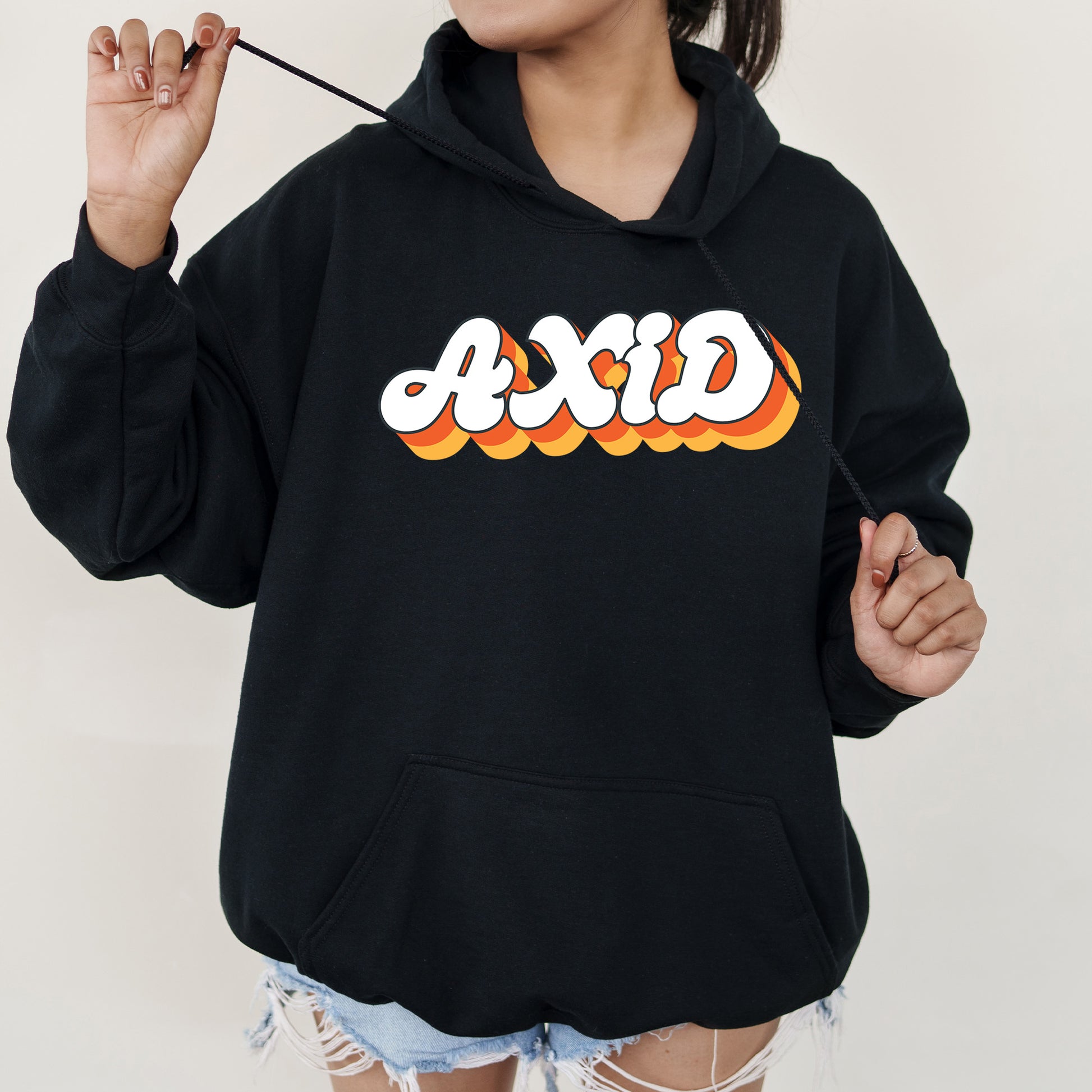 a woman wearing a black hoodie with the word dixie printed on it