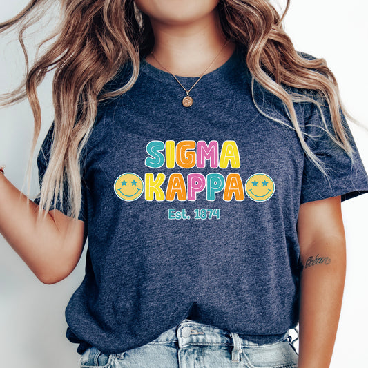 a woman wearing a t - shirt that says stigmaa kappa