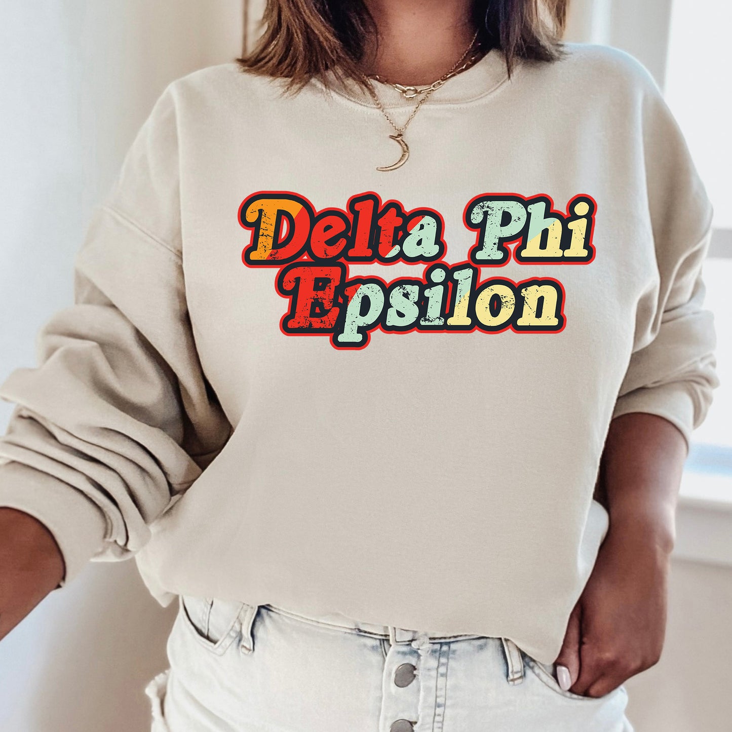 a woman wearing a sweatshirt with the words delta phi pesion on it