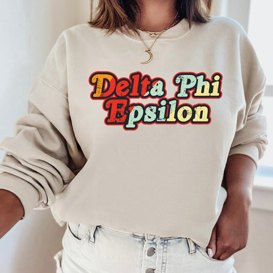 a woman wearing a sweatshirt with the words delta phi pesion on it