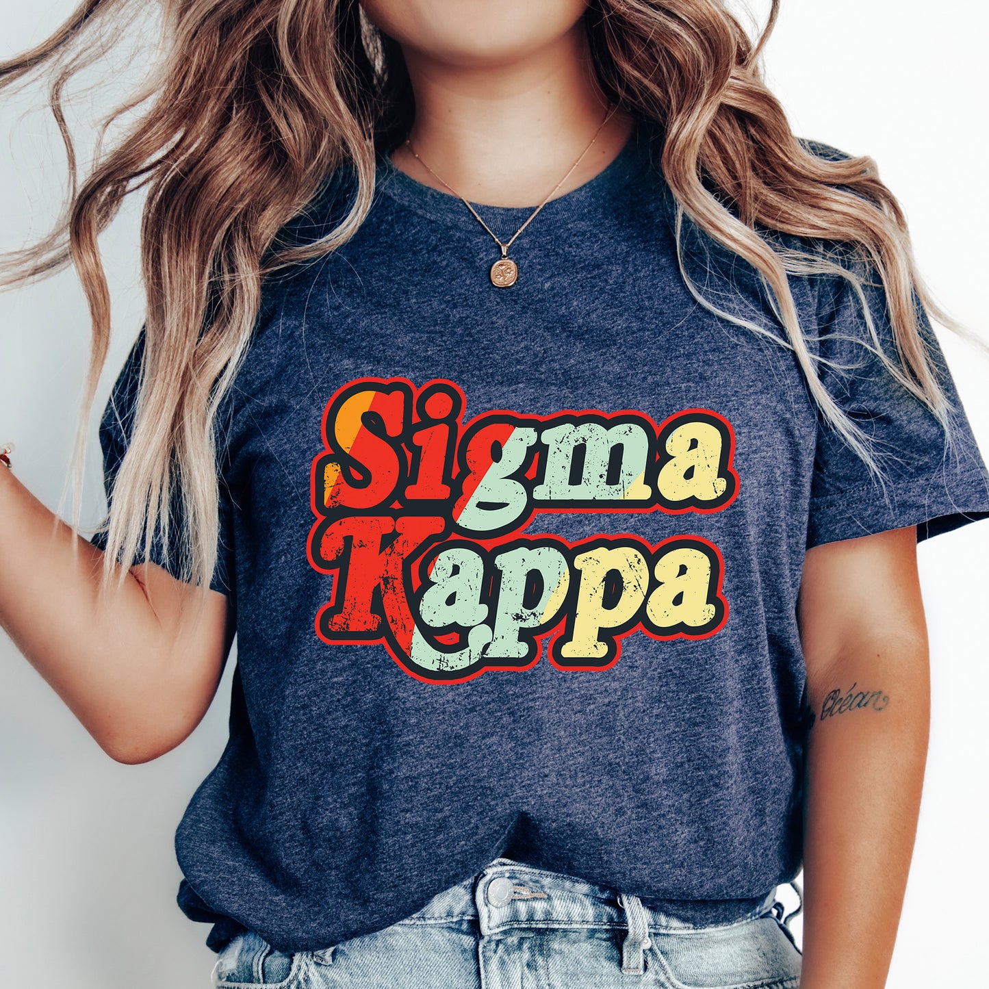 a woman with long hair wearing a t - shirt that says stigma kappa