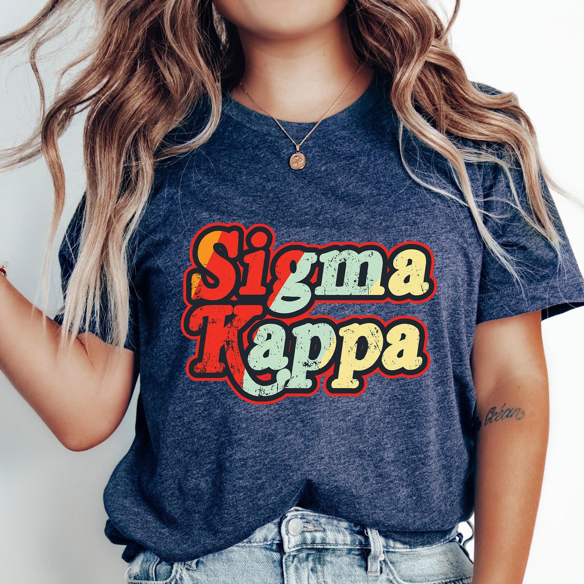a woman with long hair wearing a t - shirt that says stigma kappa
