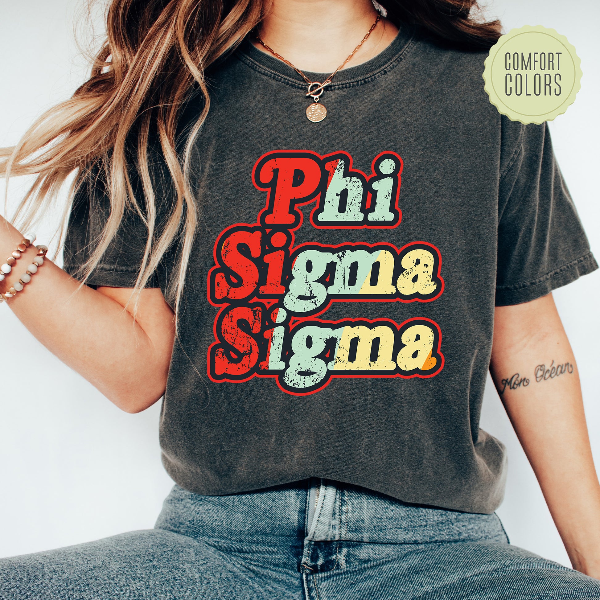 a woman wearing a phi sigma signa t - shirt