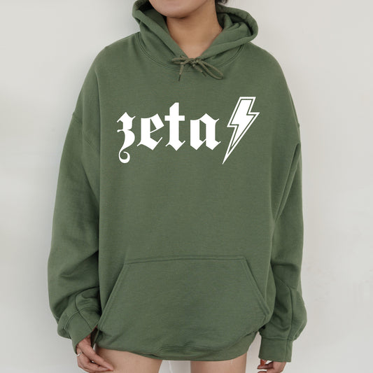 a person wearing a green hoodie with a lightning bolt on it