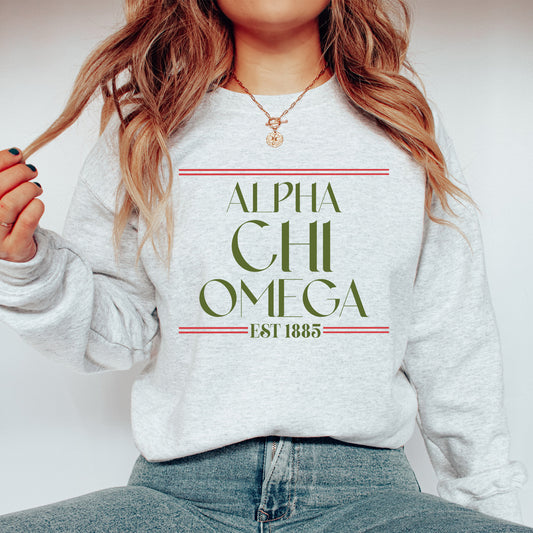 a woman wearing a sweatshirt with the words alpha chi omega on it