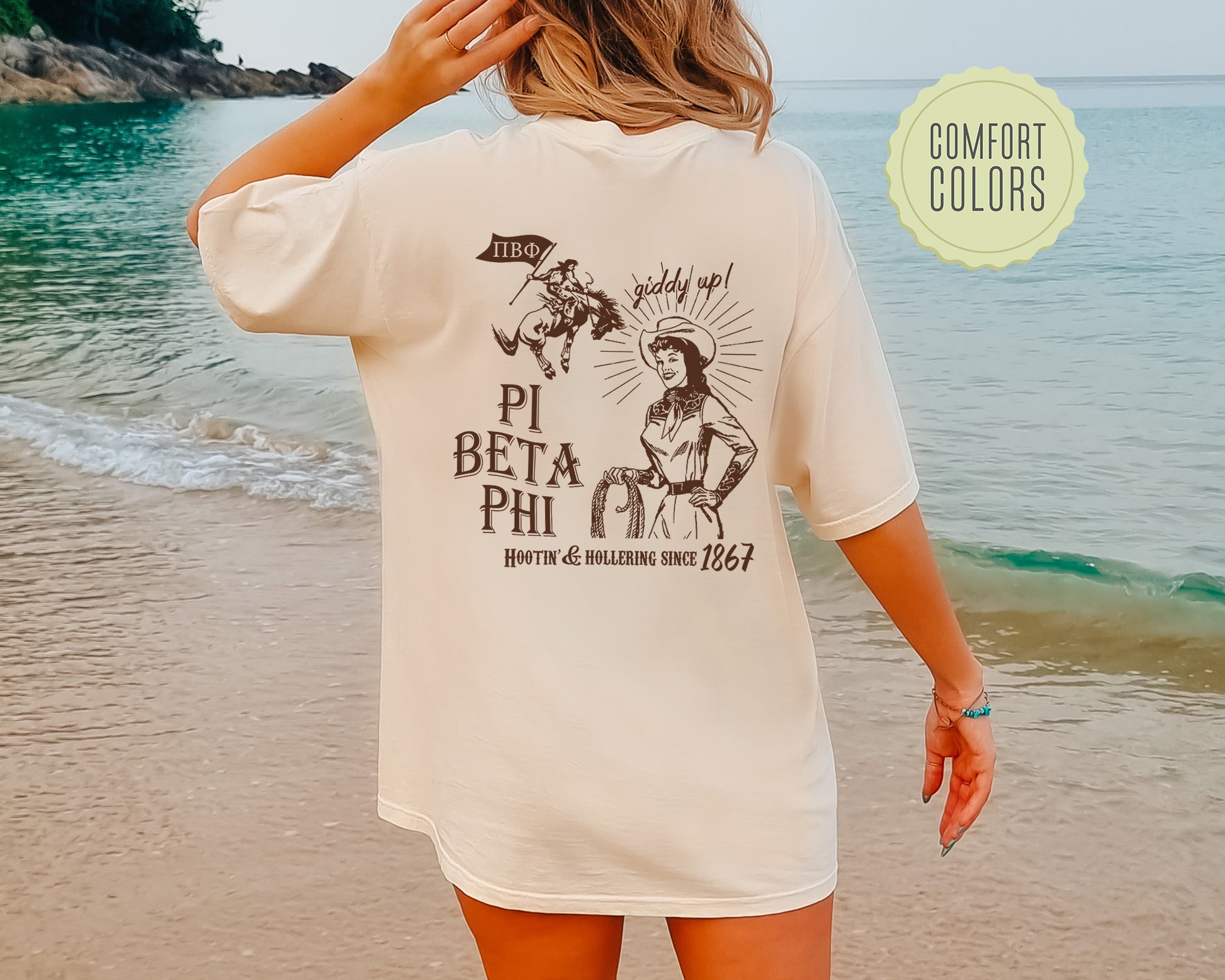 a woman standing on a beach next to the ocean