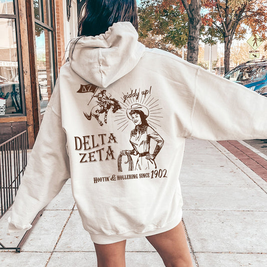 a woman in a white hoodie is walking down the street