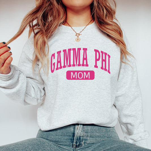 a woman wearing a sweatshirt with the word gama phi on it