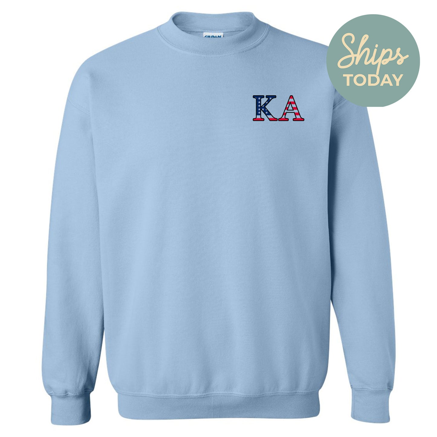 a light blue sweatshirt with the letters k and a in red, white, and