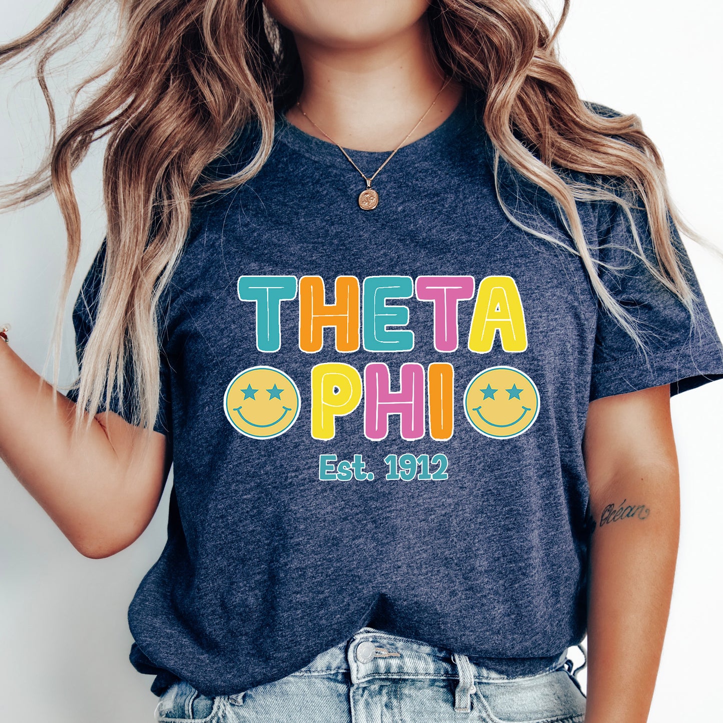 a woman wearing a t - shirt that says thea phi est 2012