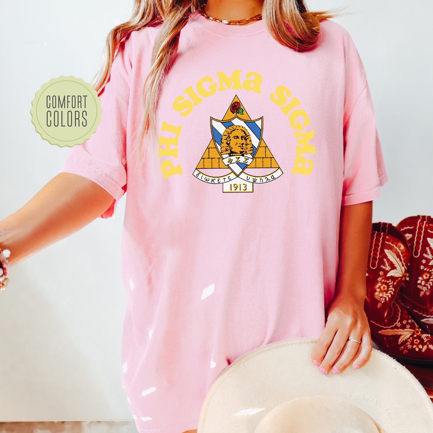 a woman wearing a pink shirt and hat