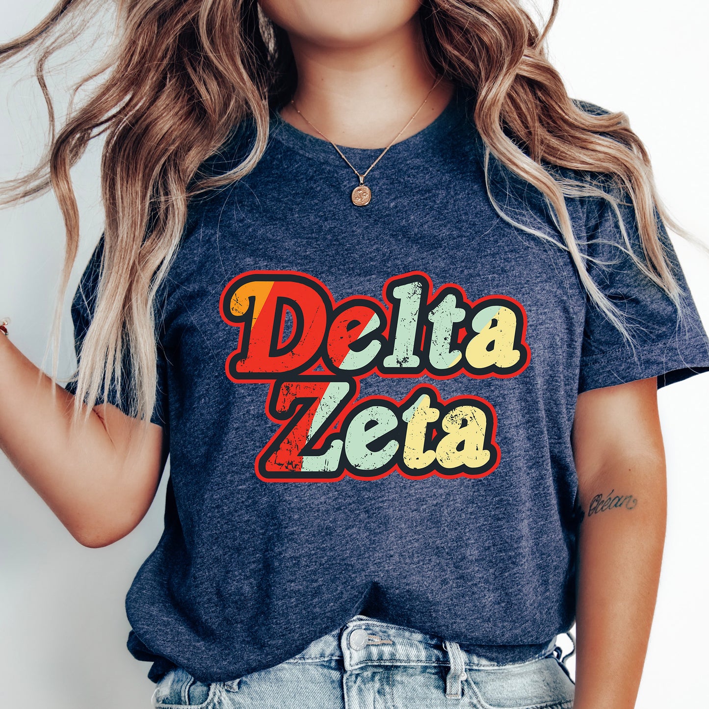 a woman with long hair wearing a delta zeta t - shirt
