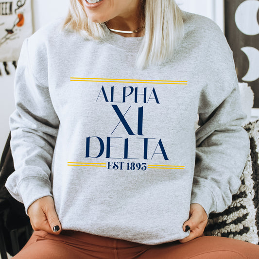 a woman sitting on a chair wearing a sweatshirt