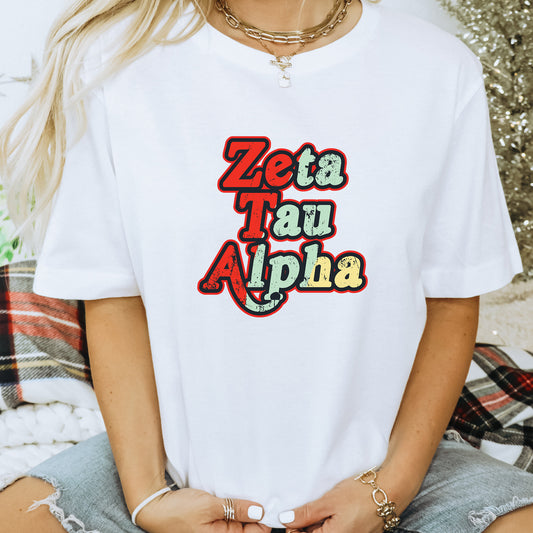 a woman wearing a white t - shirt with the word zeta taqui al