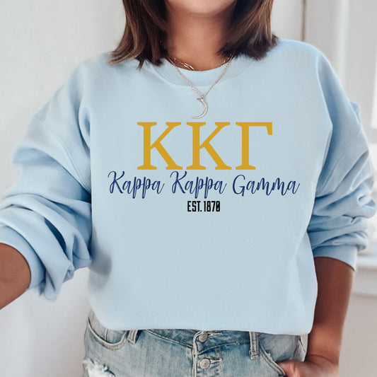 a woman wearing a blue sweatshirt that says kkt
