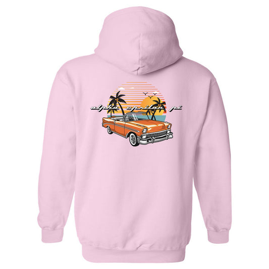 a pink hoodie with an orange car and palm trees