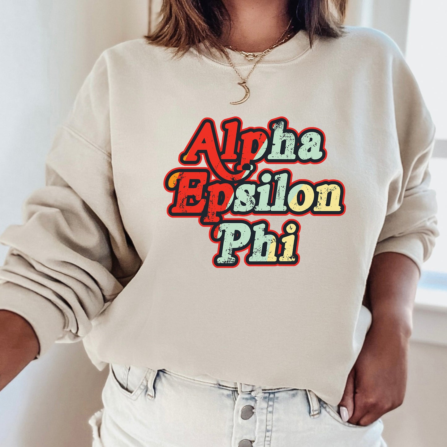 a woman wearing a sweatshirt with the words aloha epiloon phi on