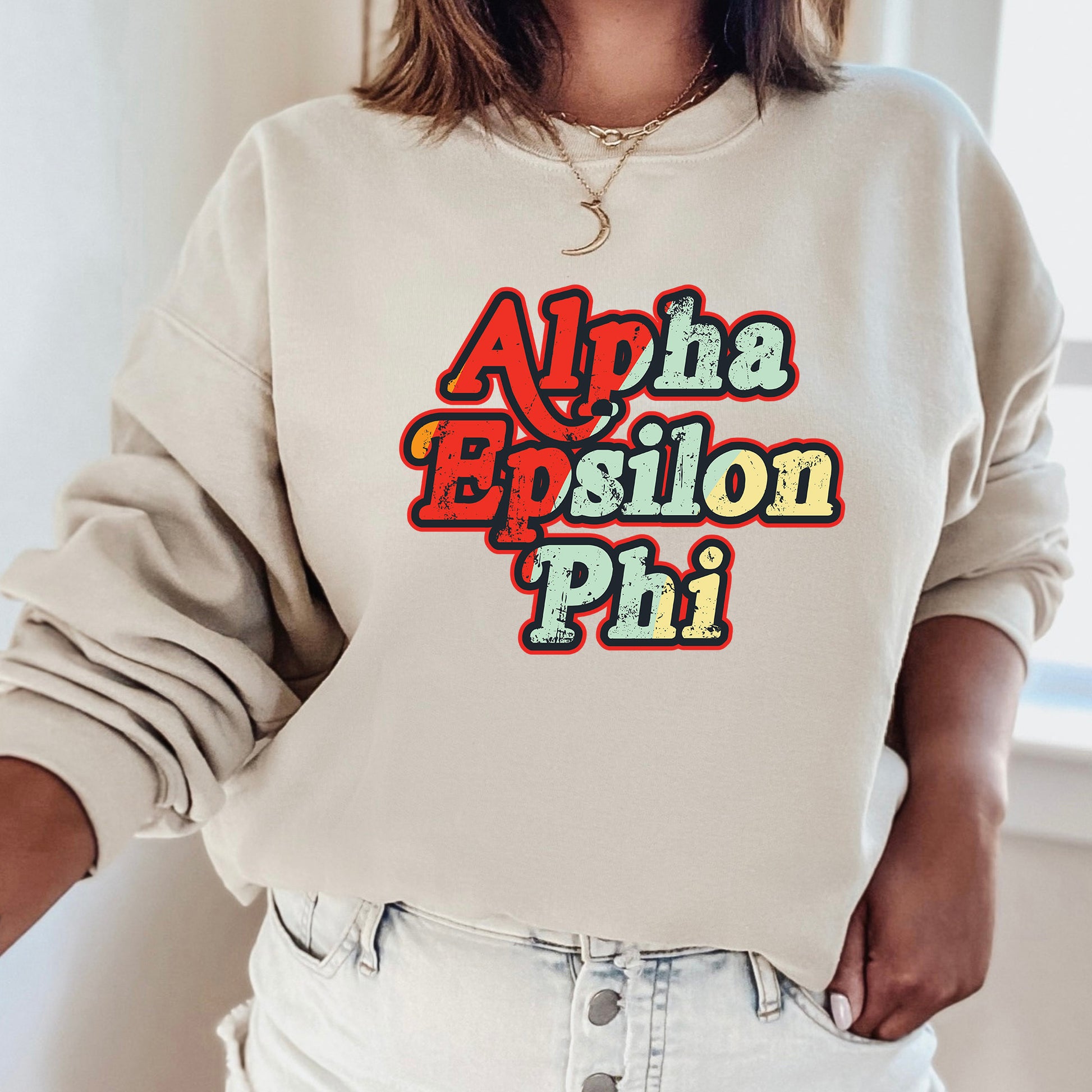 a woman wearing a sweatshirt with the words aloha epiloon phi on