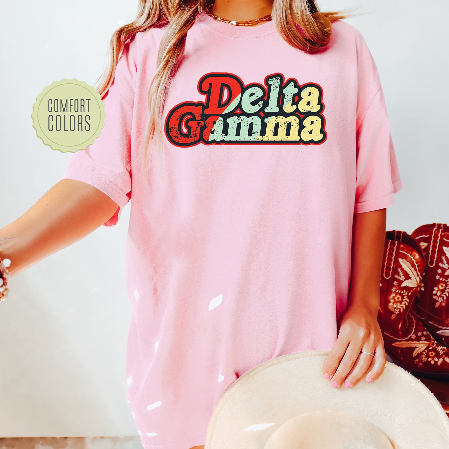 a woman wearing a pink shirt and hat