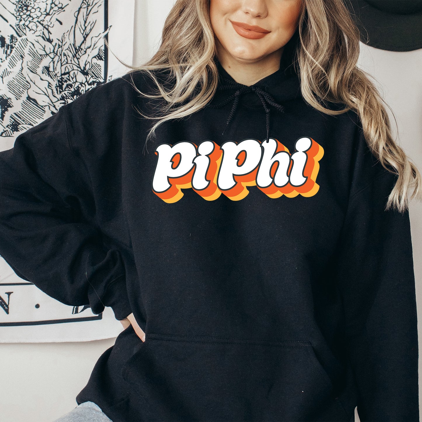 a woman wearing a black hoodie with the word pippi on it