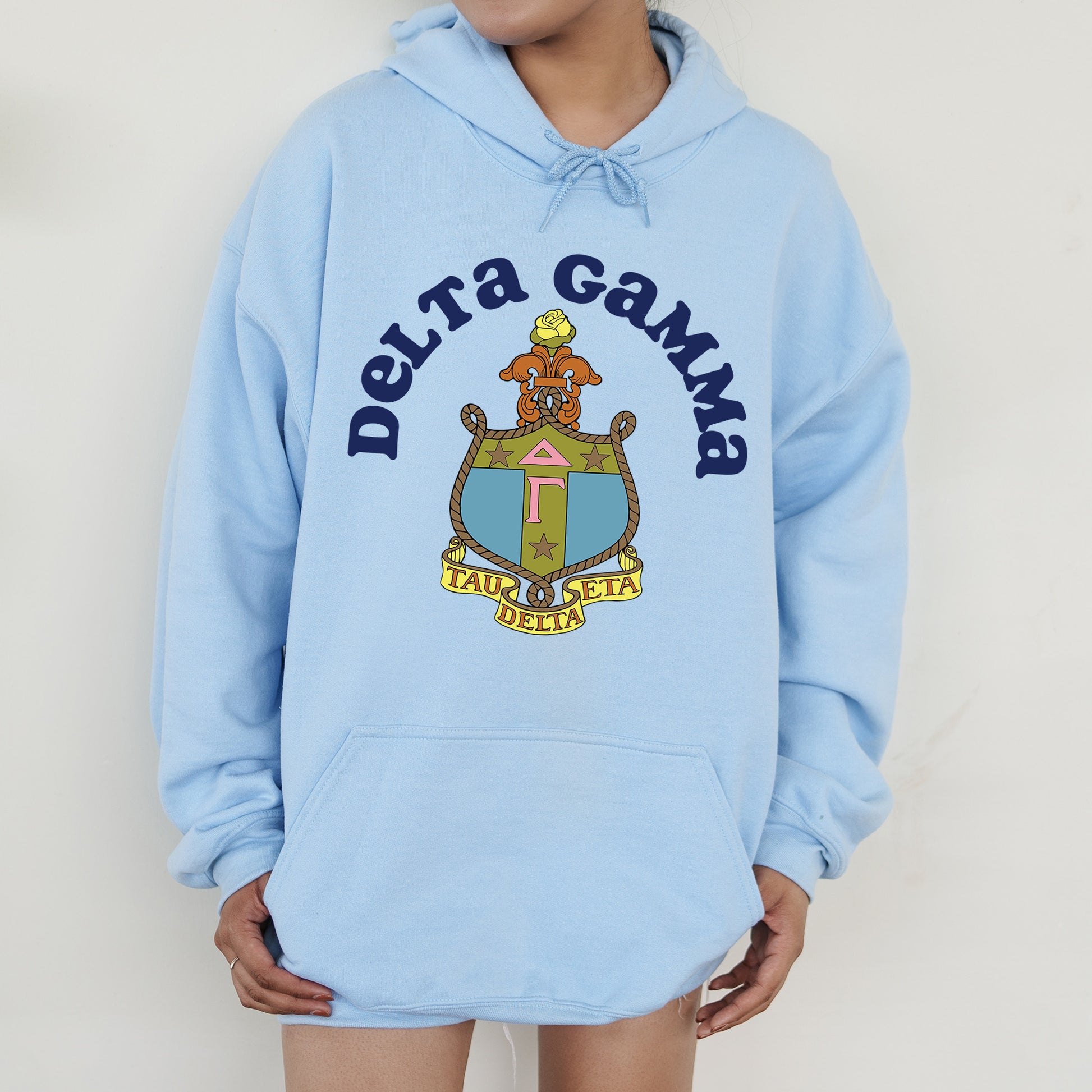 a person wearing a blue hoodie with a coat on it