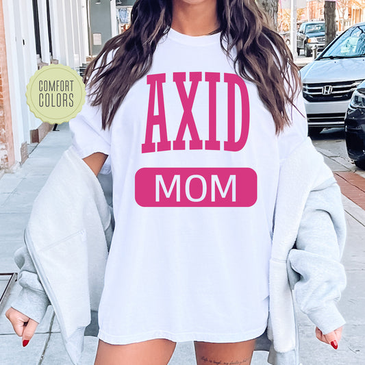 a woman wearing a shirt that says axd mom