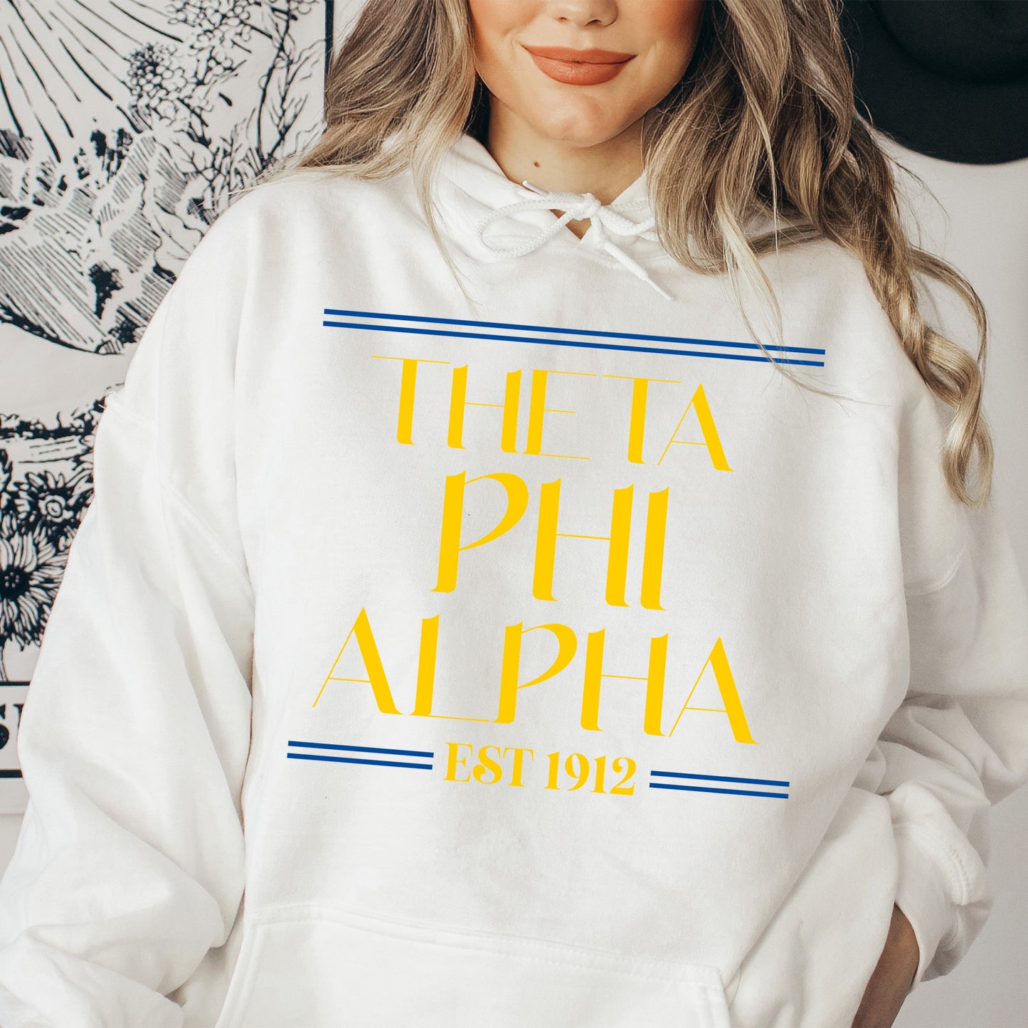 a woman wearing a white hoodie with the words the a phh alpha