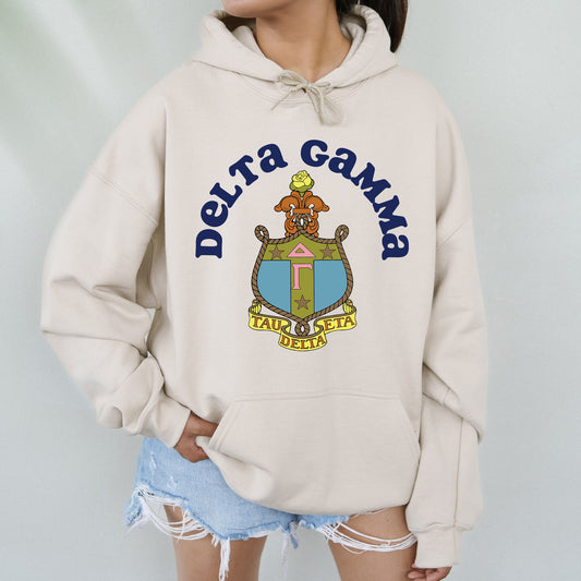 a woman wearing a white sweatshirt with the words delta gama on it