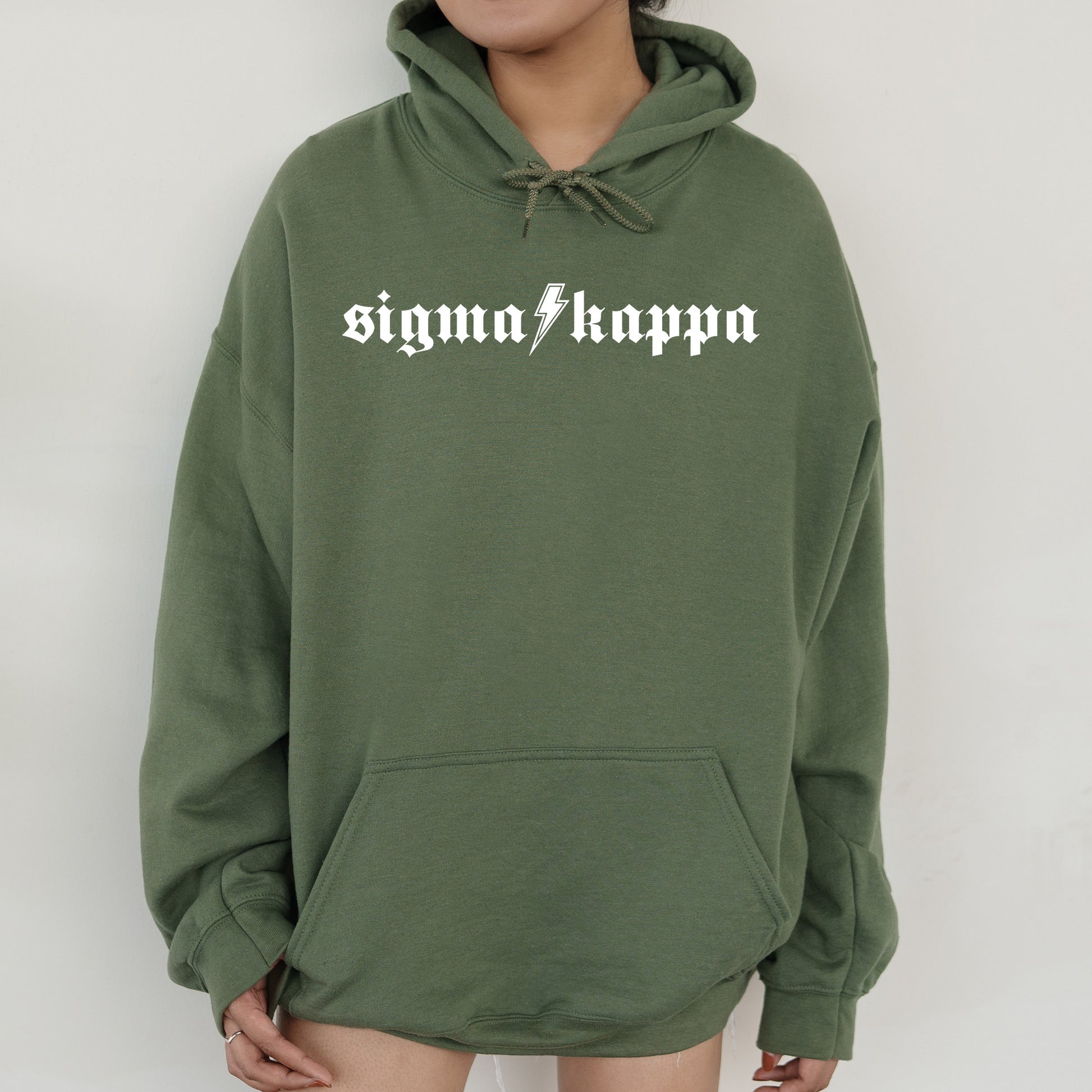 a person wearing a green hoodie with the word signin'happen on it