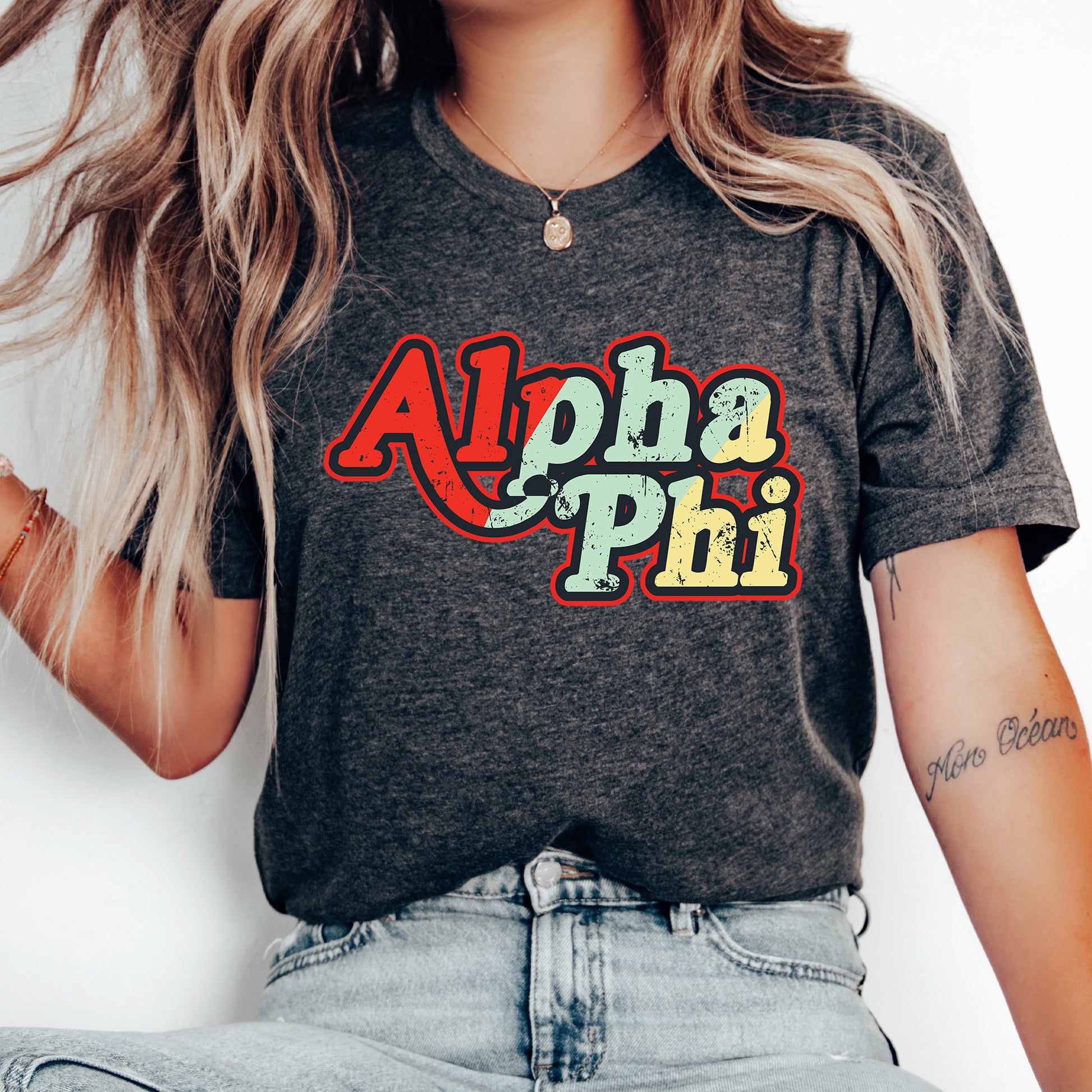 a woman with long hair wearing a shirt that says aloha phi