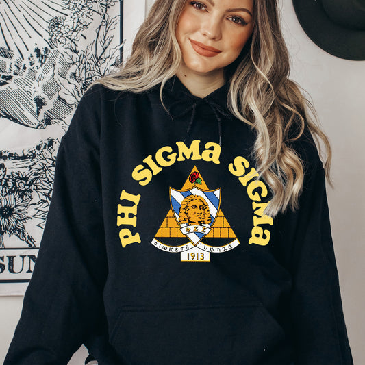 a woman wearing a black hoodie with the phi sigma sign on it