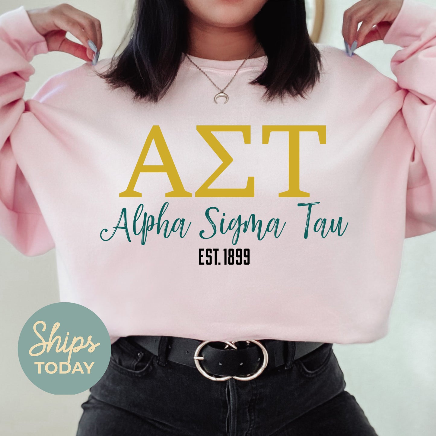 a woman wearing a pink shirt with the letters azt on it