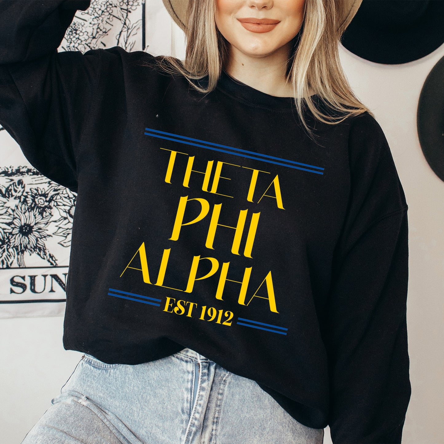 a woman wearing a hat and a black sweatshirt