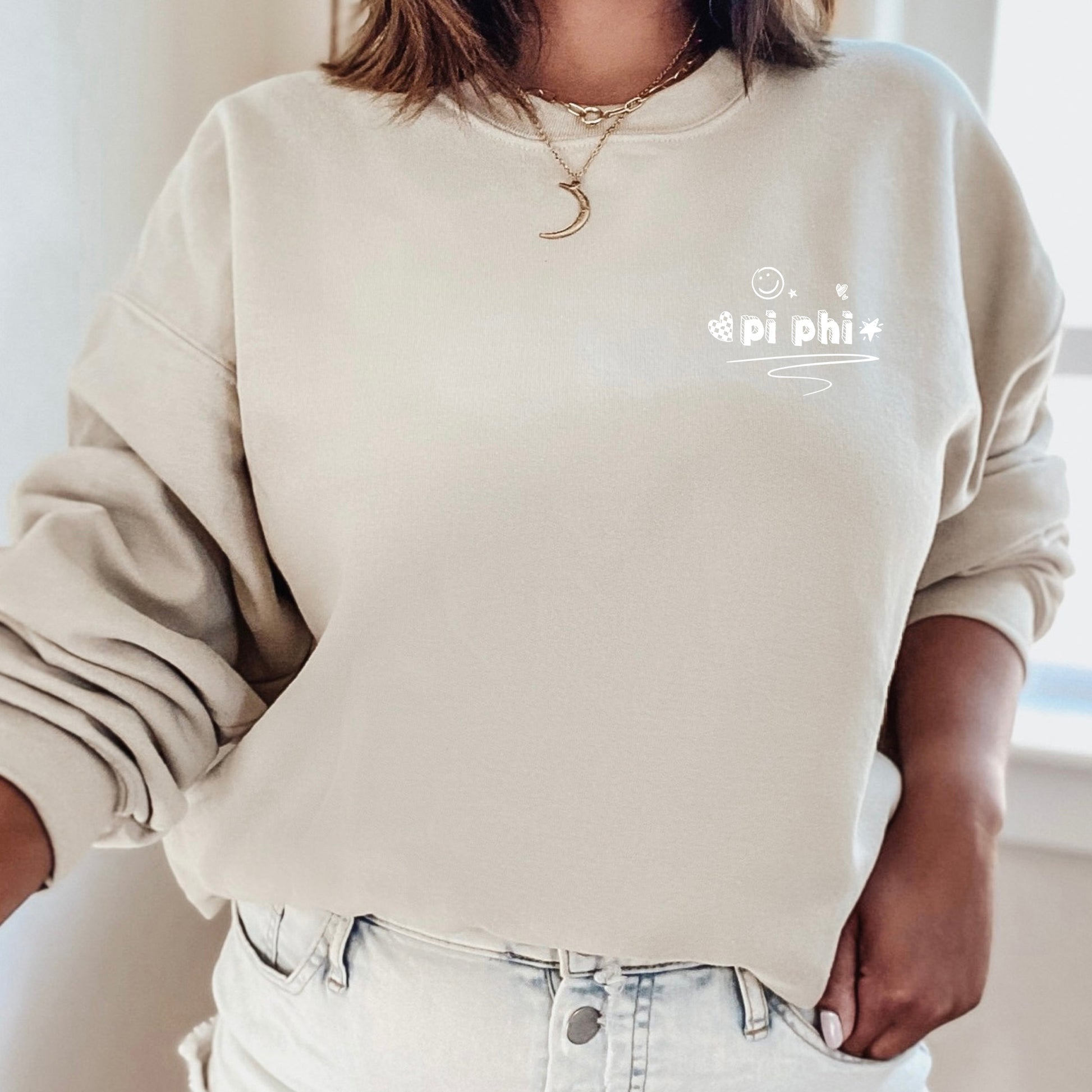 a woman wearing a white sweatshirt and jeans
